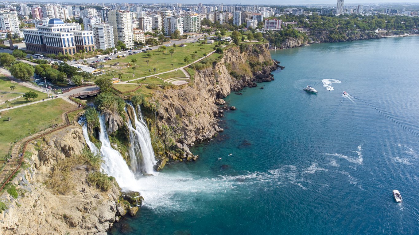 Waterfall Duden (Karpuzkaldiran selalesi) falling into the Mediterranean sea. Waterfall falling into sea. Waterfall stream. Aerial drone shooting. Antalya Turkey